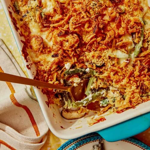 Green bean casserole with a spoon in it.