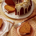 Pumpkin cake with a pistachio glazed cut with slices.