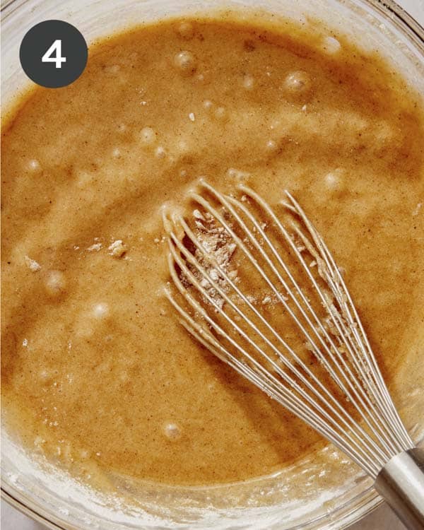 Pumpkin cake batter being mixed in a bowl.
