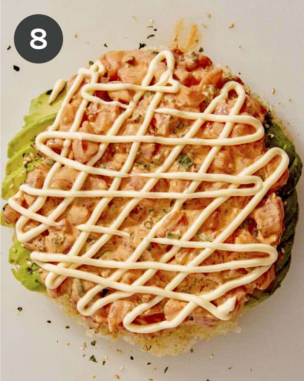 Sushi pizza with salmon and kewpie on top.