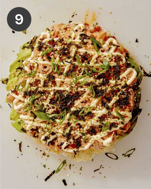 Sushi pizza with all the toppings on top.