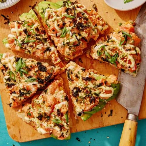 Sushi pizza recipe on a cutting board.