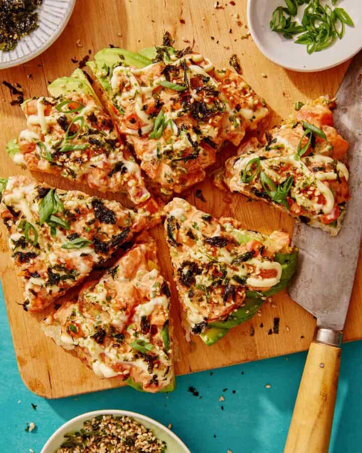 Sushi pizza recipe on a cutting board.