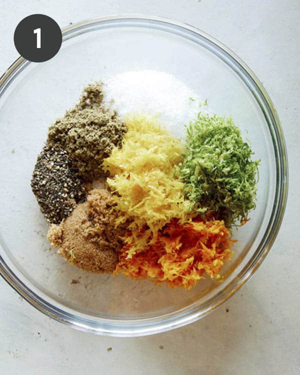 Ingredients for a citrus dry brine for a turkey in a glass bowl.