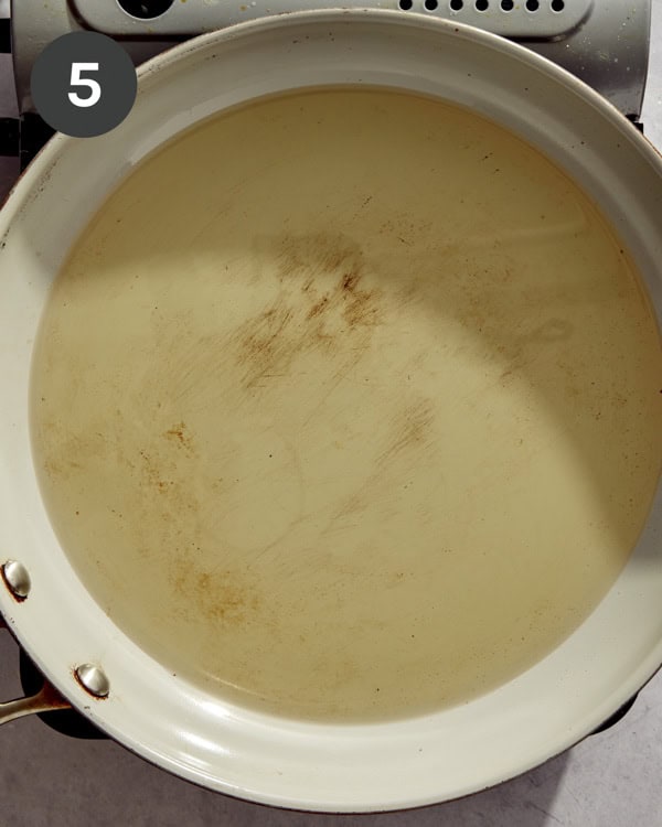 Hot oil in a pan ready to cook potato latkes in.