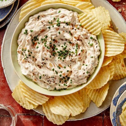 French onion dip recipe in a bowl with chips on the side.
