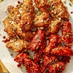 Close up on a platter of Korean fried chicken with two different sauces.