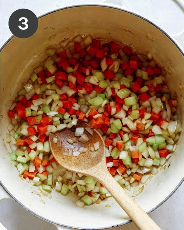 Saute carrots and celery in a stock pot.