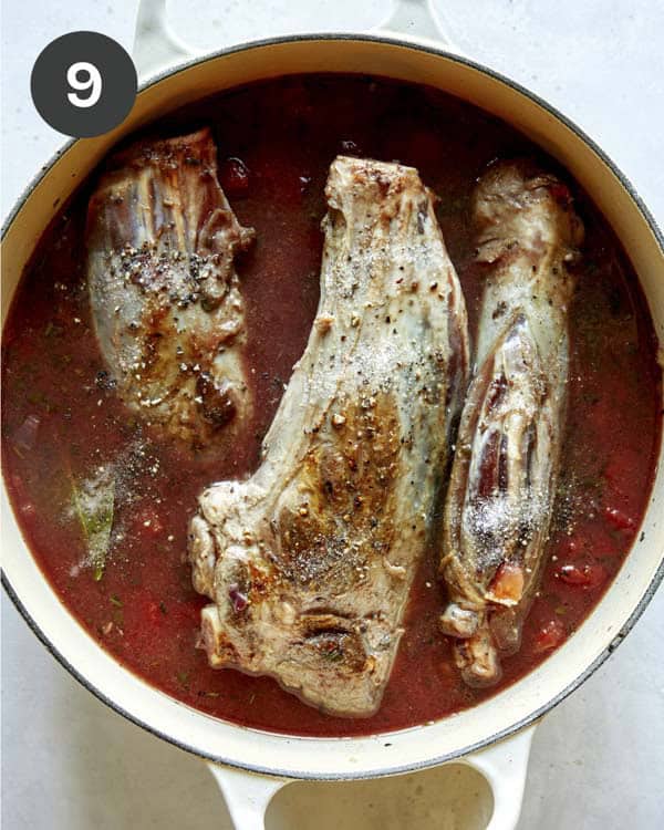 Lamb shanks in a pot ready to be braised.