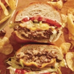 Chopped cheese sandwich with chips on the side.