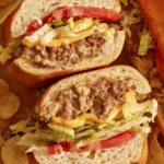 Chopped cheese sandwich with chips on the side.