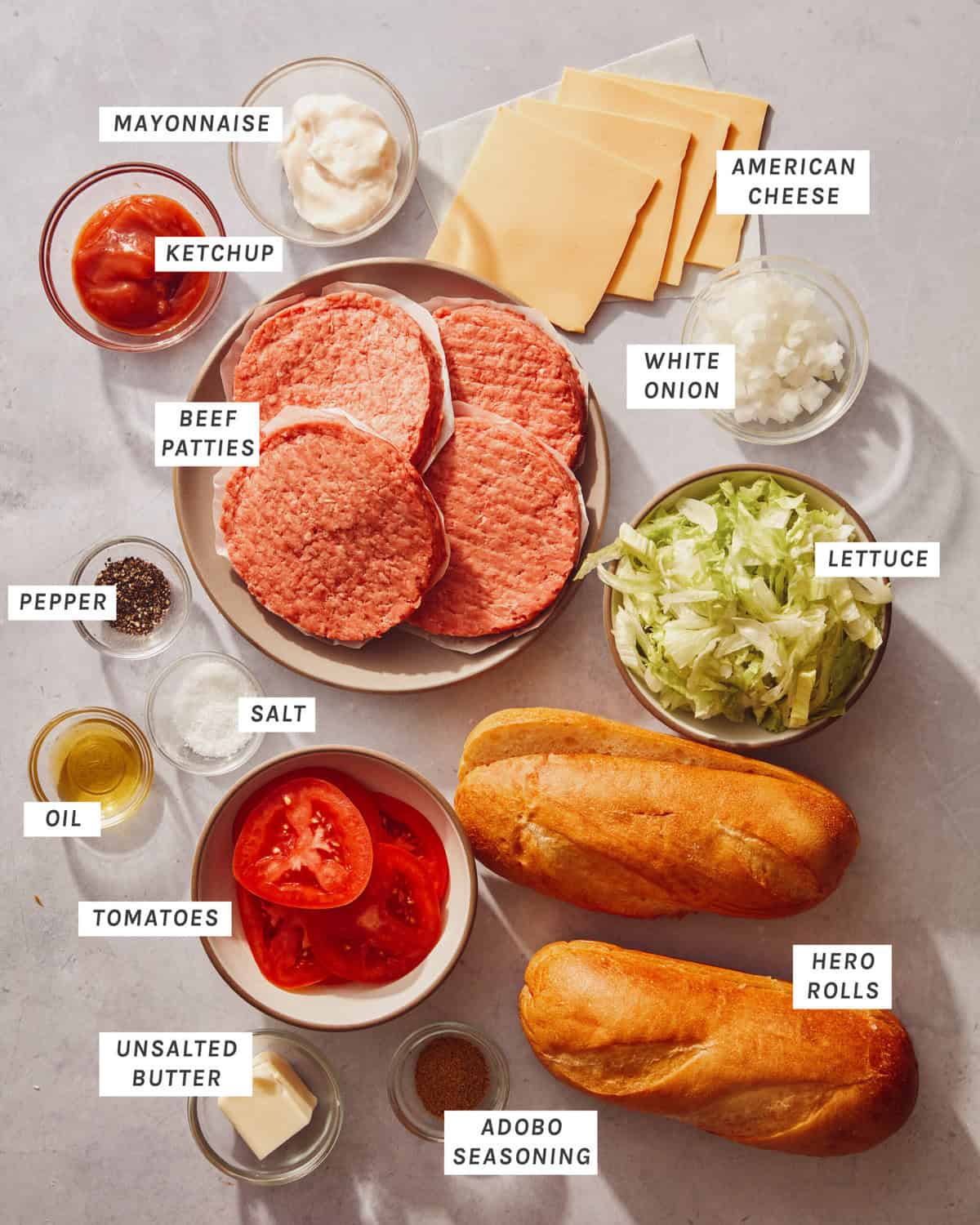Ingredients for a chopped cheese sandwich on a kitchen counter.