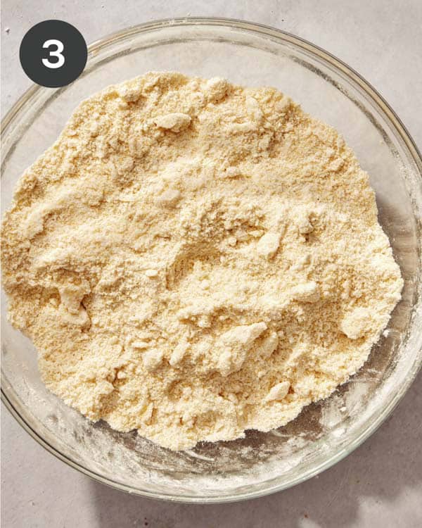 Cornbread dough in a glass bowl.