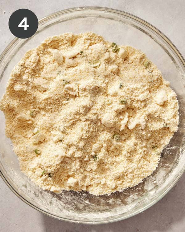 Cornbread dough with green onions added in and mixed together.