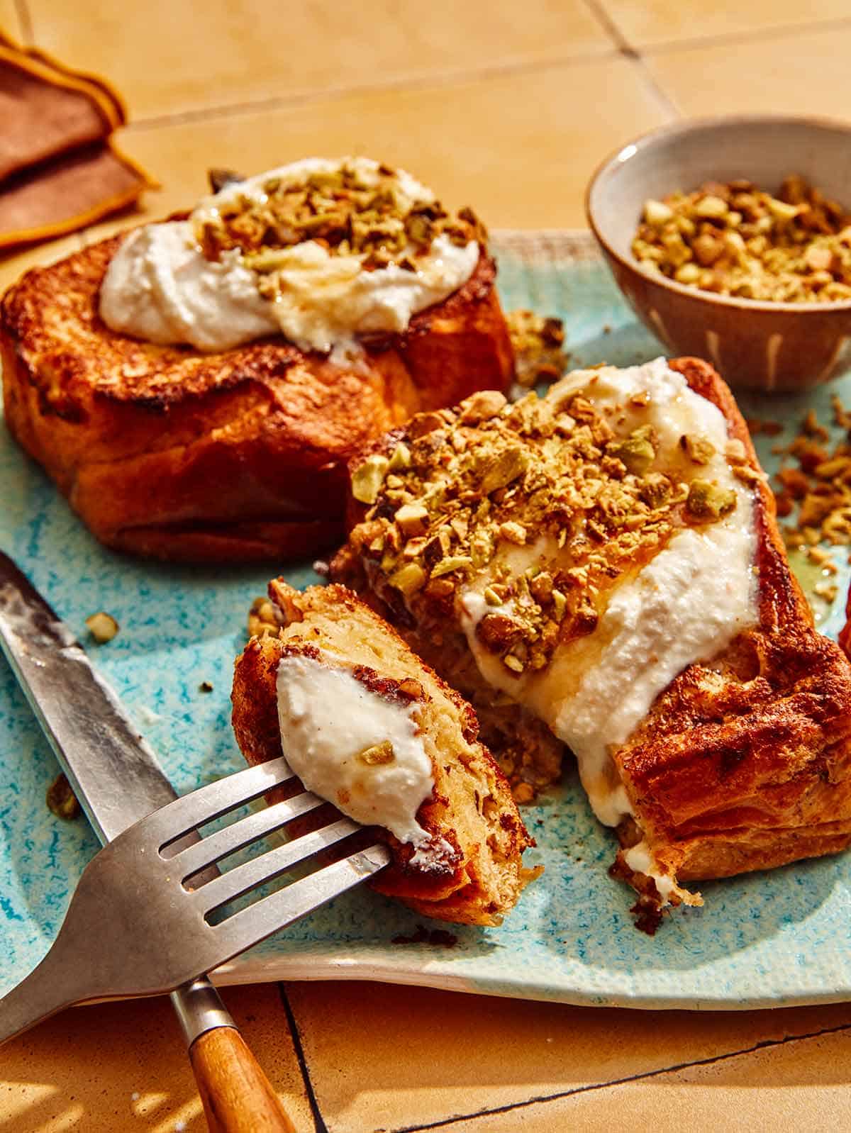 A thick piece of french toast with a bite cut out of it.