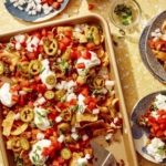 Frito pie recipe with ingredients around it.