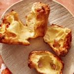 A popover on a plate torn in half.