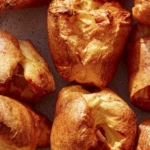 Close up on a plate of popovers.