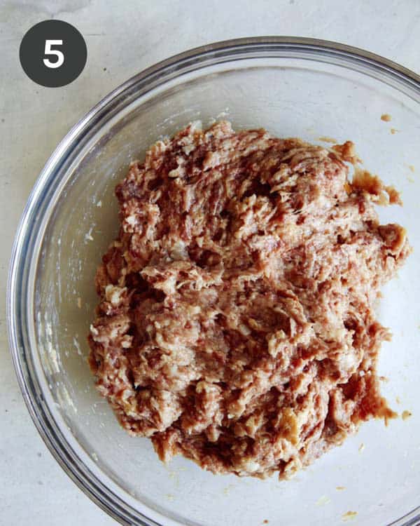 Swedish Meatball mixture in a glass bowl ready to be balled up.