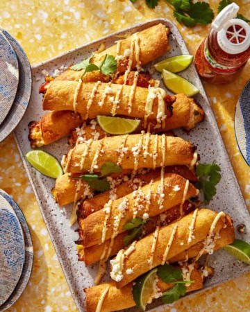 Homemade taquitos on a platter made with an air fryer.