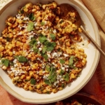 Close up on a bowl of Mexican street corn salad.