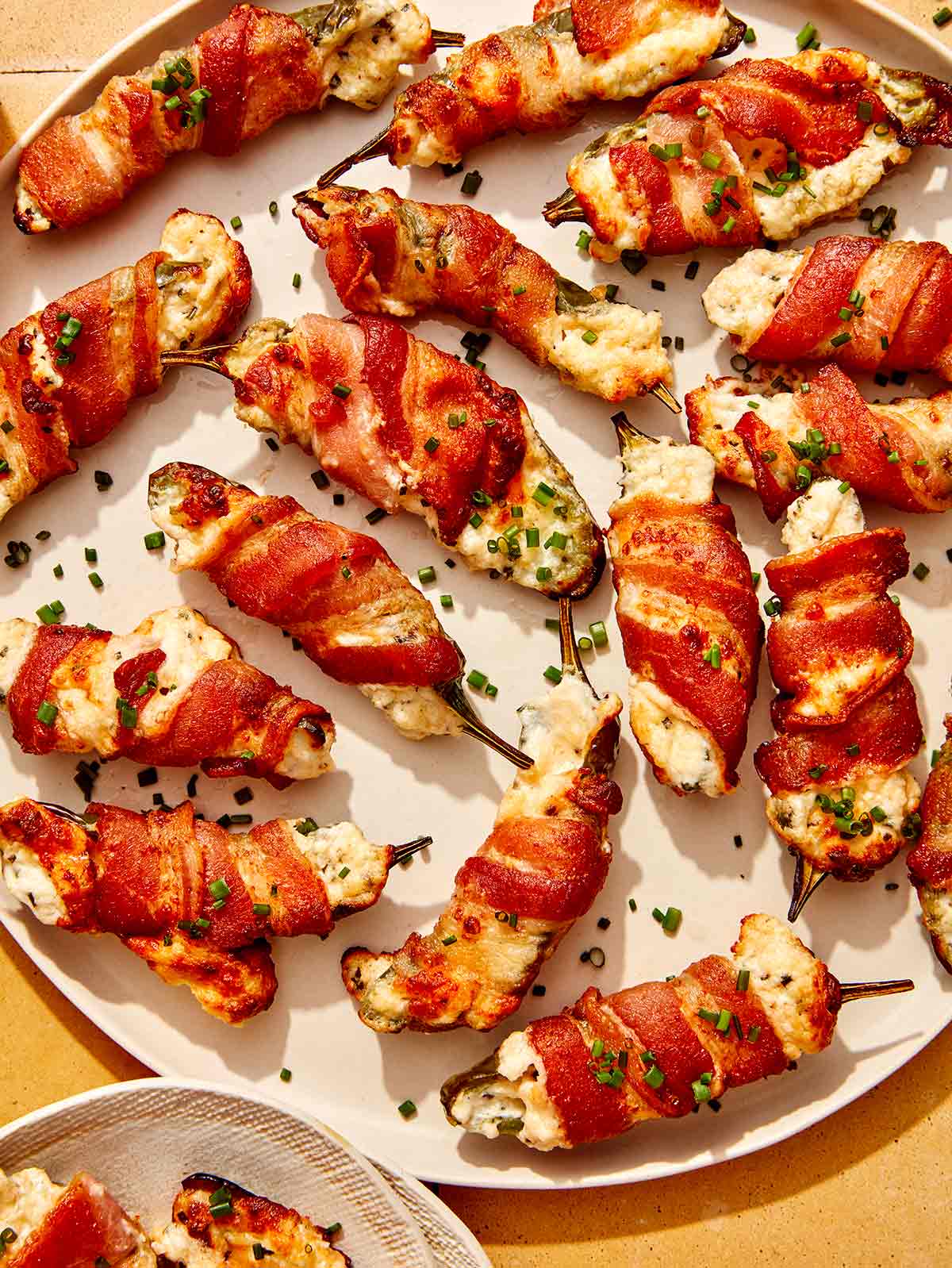 Jalapeno poppers on a platter up close.