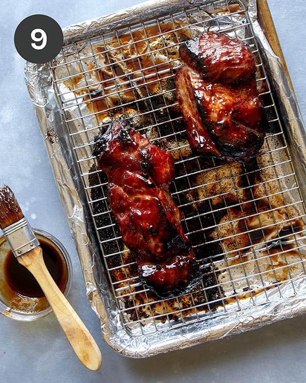 Char siu on a baking sheet after it was cooked and basted.