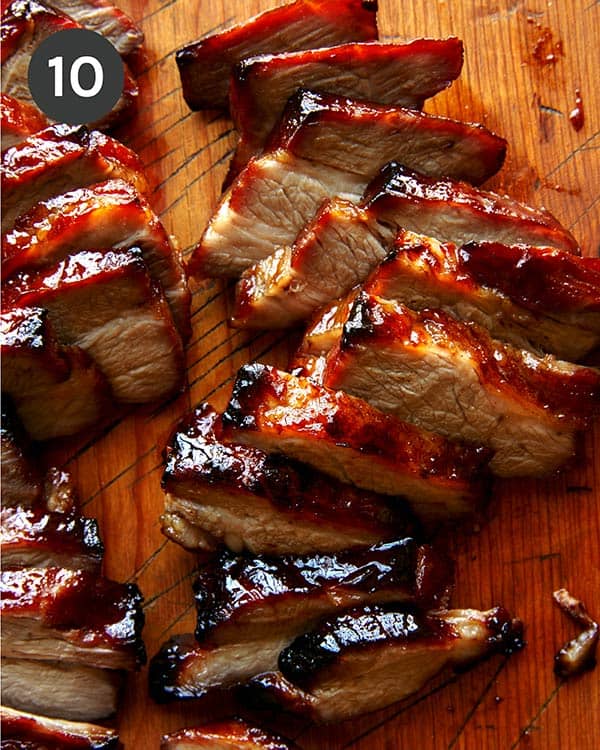 Char siu cut up on a cutting board.