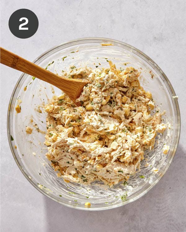 Taquito filling mixed in a glass bowl.