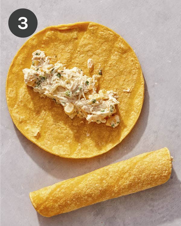 Filling scooped onto a corn tortilla.