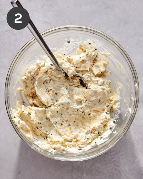 Jalapeno popper filling ingredients mixed together in a bowl.