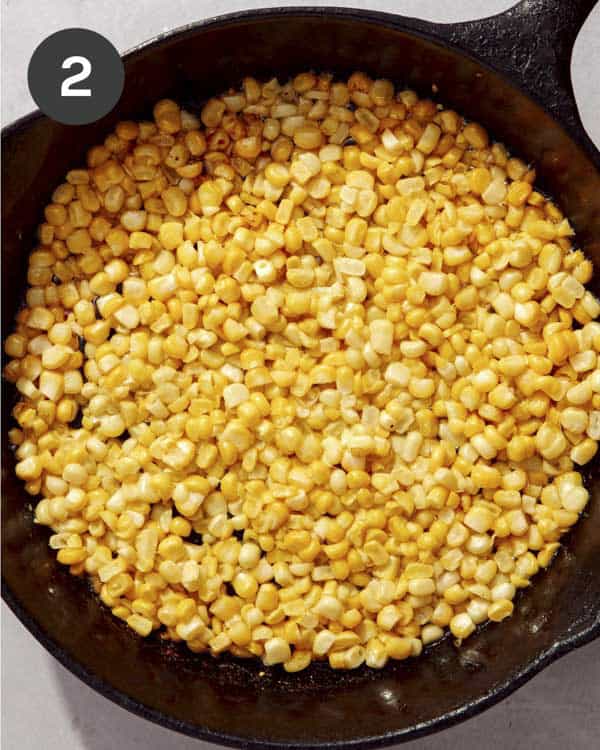 Corn browning in a skillet.