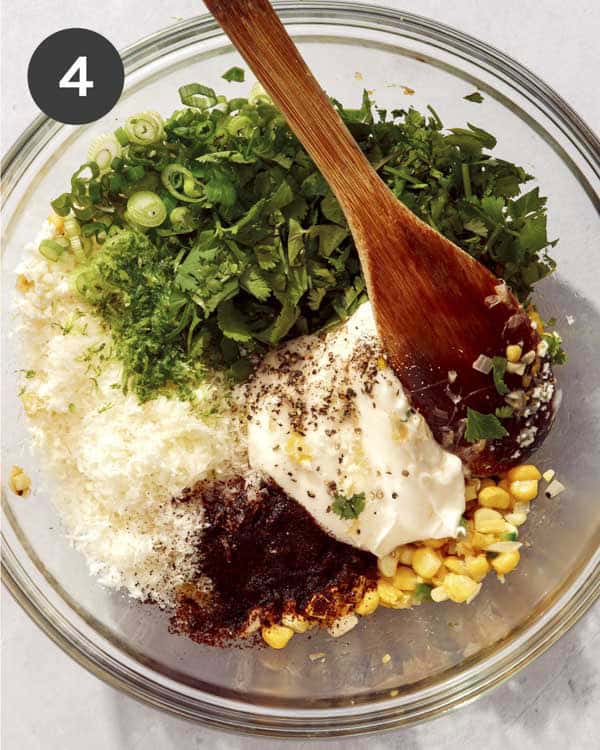 Mexican street corn ingredients in a glass bowl.