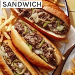 A platter of Philly Cheesesteak sandwiches with fries next to it.