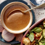 Balsamic vinaigrette in a bowl with a spoon.