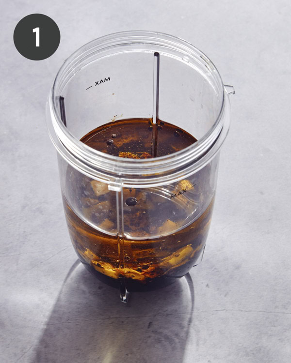 A blender full of ingredients to make balsamic vinaigrette.