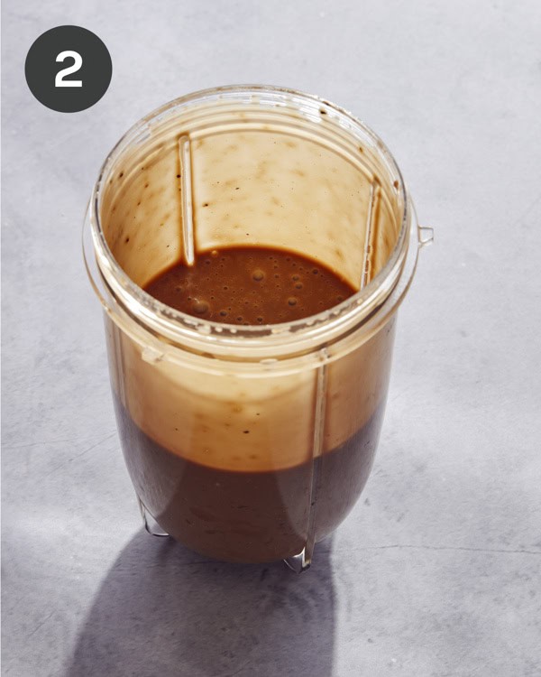 A blender with freshly blended balsamic vinaigrette.
