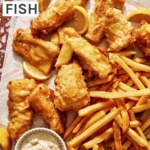 Beer battered fish with french fries and tartar sauce ready to be eaten.