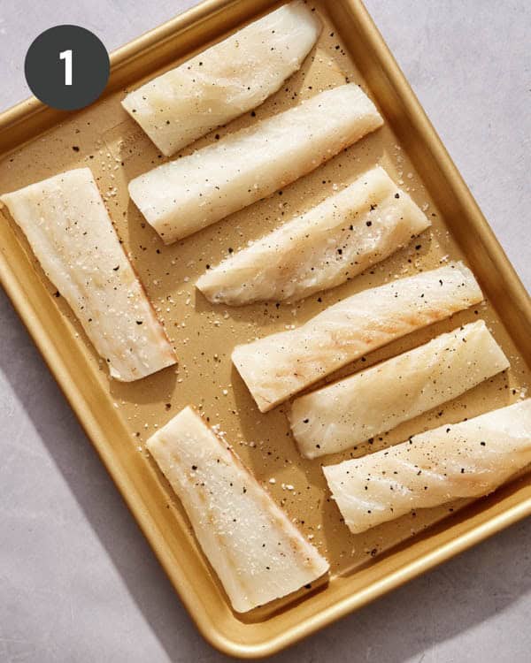Cod fillets seasoned with salt and pepper to make beer battered fish.