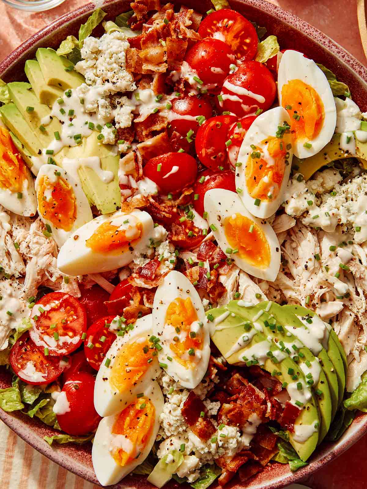 A bowl of cobb salad up close.