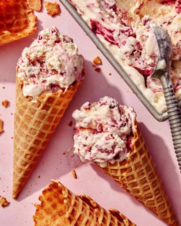 No churn ice cream with waffle cones next to the container.