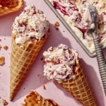 No churn ice cream with waffle cones next to the container.