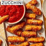 Fried zucchini on a platter being served to guests.