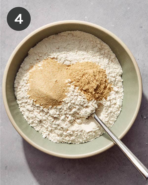 Flour being combined with seasoning.