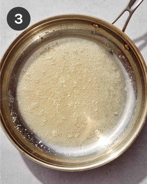 Butter melted in a skillet.
