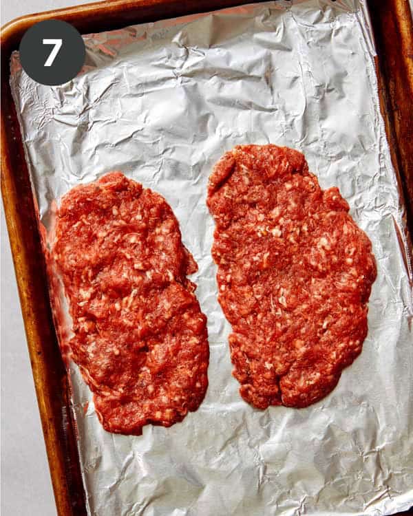 Ground beef being formed into patties.