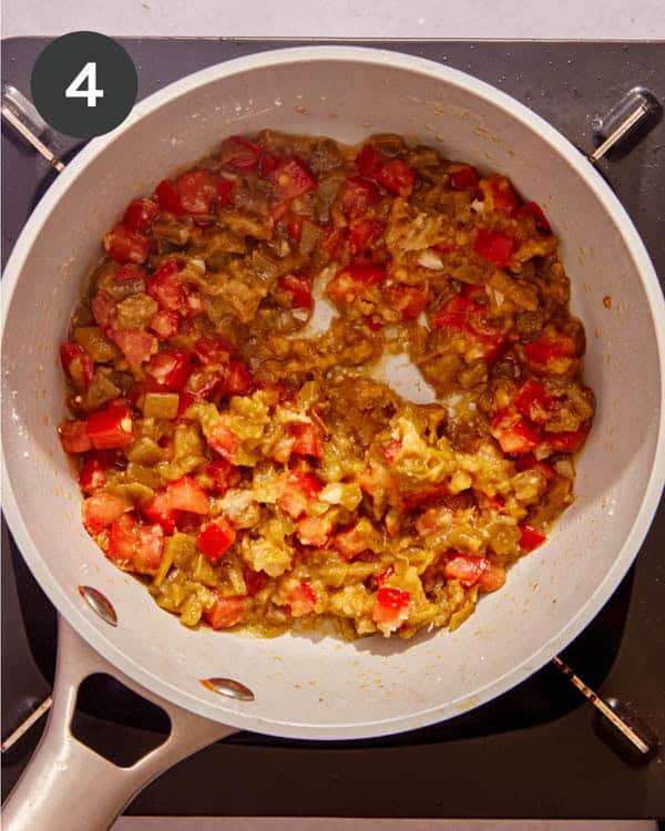 Vegetables being mixed with cornstarch to make queso.