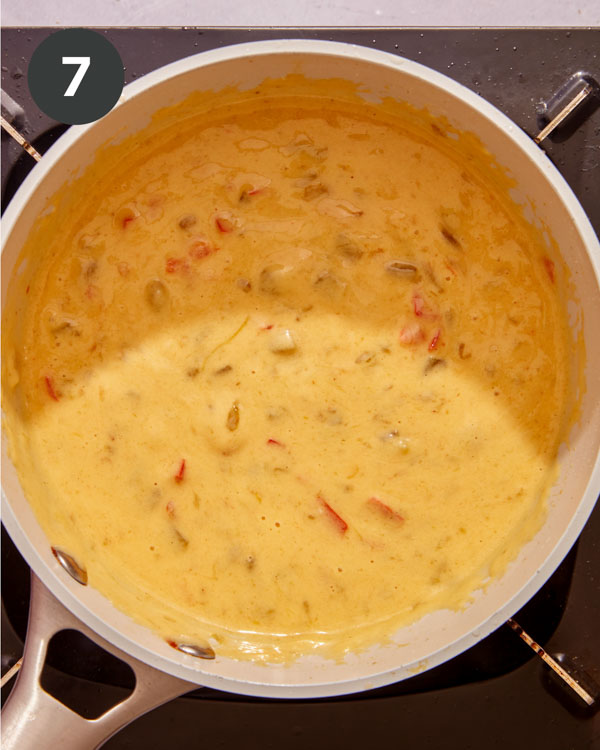 Queso cooking in a pot.