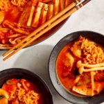 Budae Jjigae in two bowls.