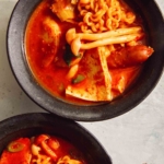 Budae Jjigae in two bowls.